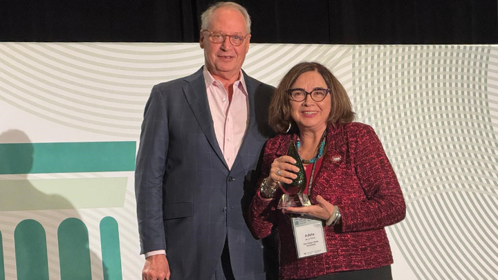 SDSU President Adela de la Torre testified accepts the 2024 International Impact Award for Global Engagement from the Association of Public and Land Grant Universities during a ceremony.