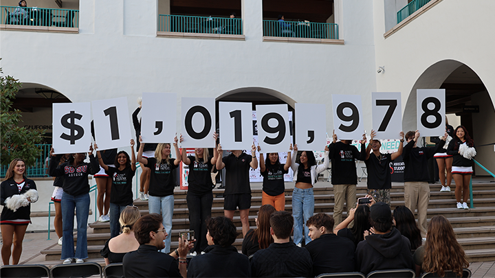 SDSU students unveiling the grand total of donations raised at the Aztecs Rock Hunger Results Reveal: over $1 million in lifetime contributions.