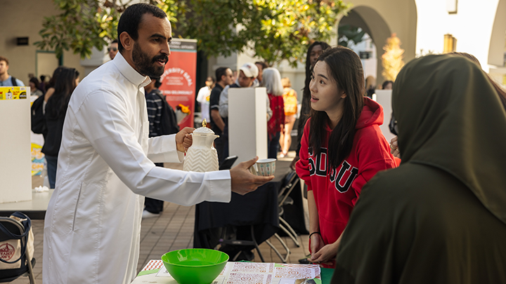 SDSU students from Saudi Arabia shared food and drinks at their table during Peace Village. (Photo: Jonathan Frederick)