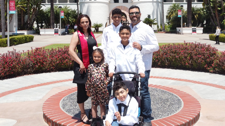 The Gonzalez family at SDSU for Commencement 2024. Clockwise from center: Nicholas, Gio, Ximena, Brenda, Saul and Jose. 