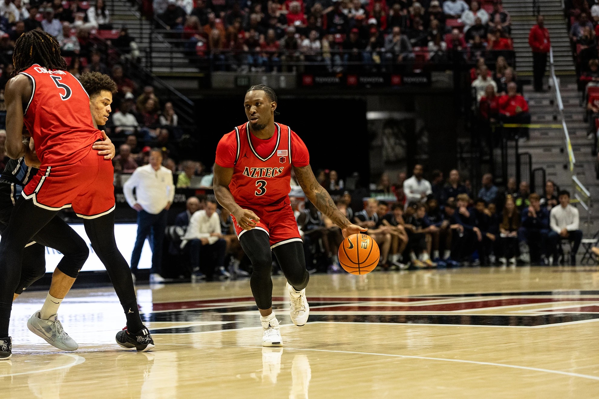 SDSU's Wayne McKinney III dribbles the ball against an Air Force defender.