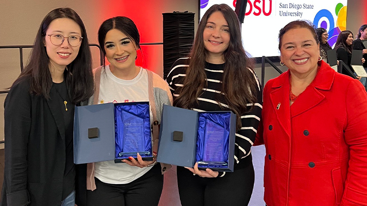 Clarissa Miranda poses with her Student Teacher of the Year Award alongside two other colleagues