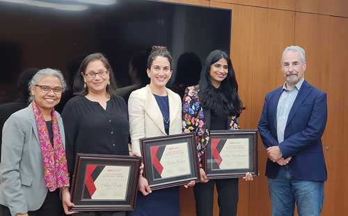 Three faculty members from SDSU’s Fowler College of Business pose for a photograph with the dean