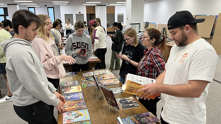 Students explore the Comic Arts Collection for research topics. 