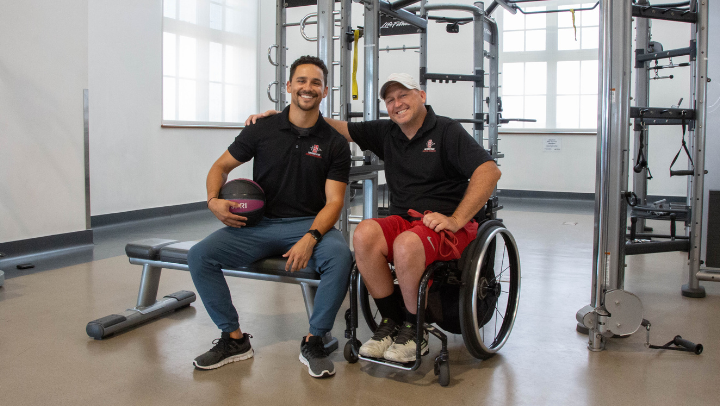 A.J. Munoz-Bond (left) with wheelchair tennis head coach and fellow alumnus Greg Hasterok (‘04). 