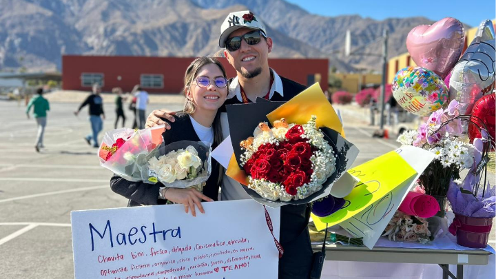 Grisele Avila (left) with her husband during the surprise walk parade celebrating the award announcement. (Photo courtesy of Grisele Avila)