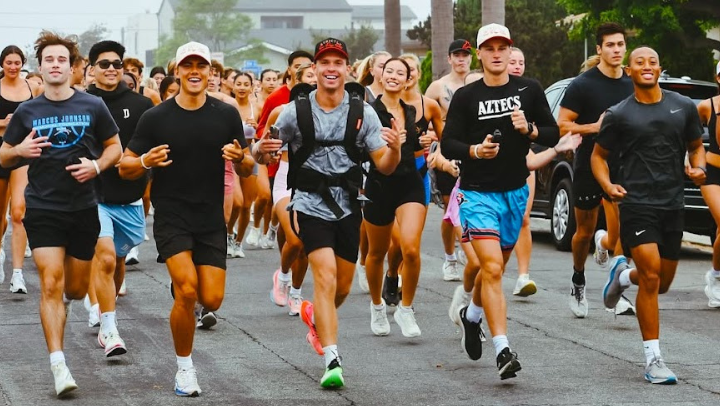 Aztecs basketball player Ryan Schwarz, second from right, started the Strictly Run Club in 2024 growing membership from 15 runners to over dozens. 