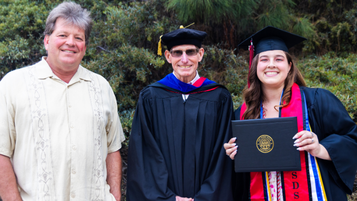(From left) Raab Rydeen, Bruce Urquhart, and Emma Rydeen at SDSU’s 2025 Commencement Ceremony. (SDSU)