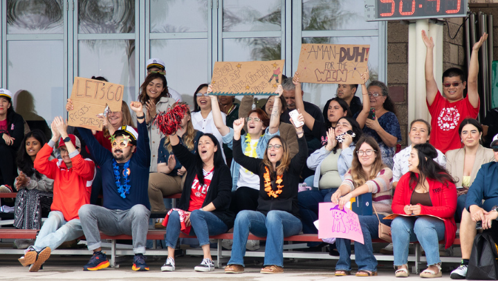 Staff and faculty cheer on their colleagues during a special event on campus just for employees.